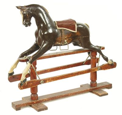 Appraisal: A painted wood rocking horse in cm h in cm