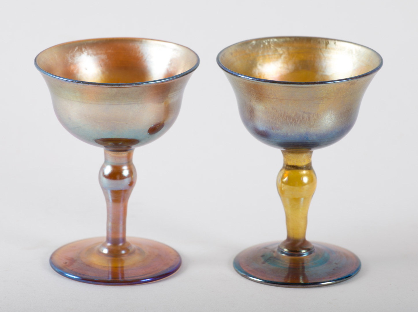 Appraisal: Pair of Tiffany Favrille glass wine stems first quarter- th