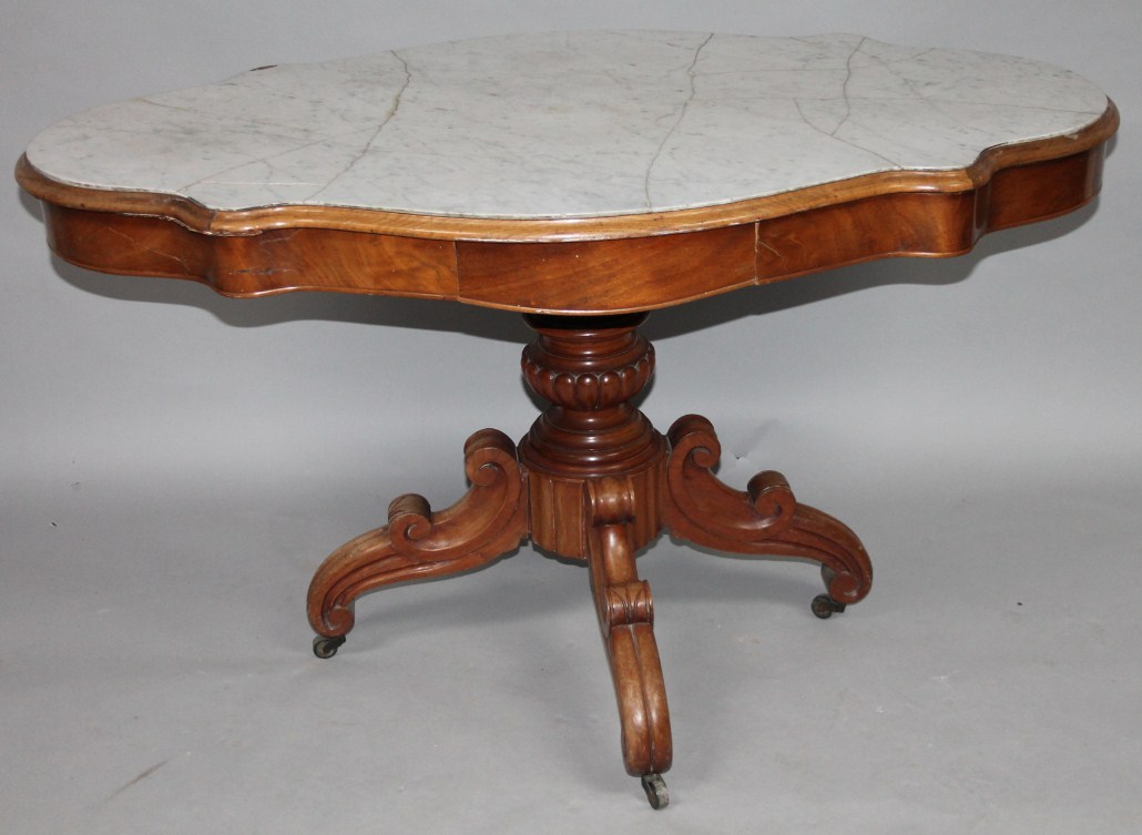 Appraisal: A thC mahogany occasional table the shaped top inset with