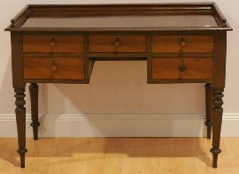 Appraisal: A Victorian style stained pine desk wide cm deep cm