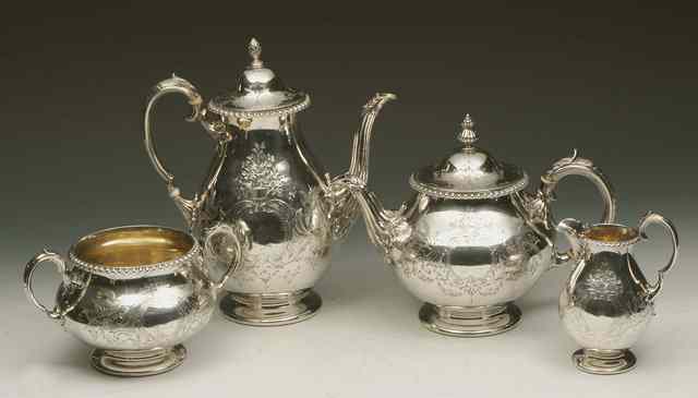 Appraisal: A VICTORIAN FOUR PIECE SILVER TEA SET baluster shaped teapot