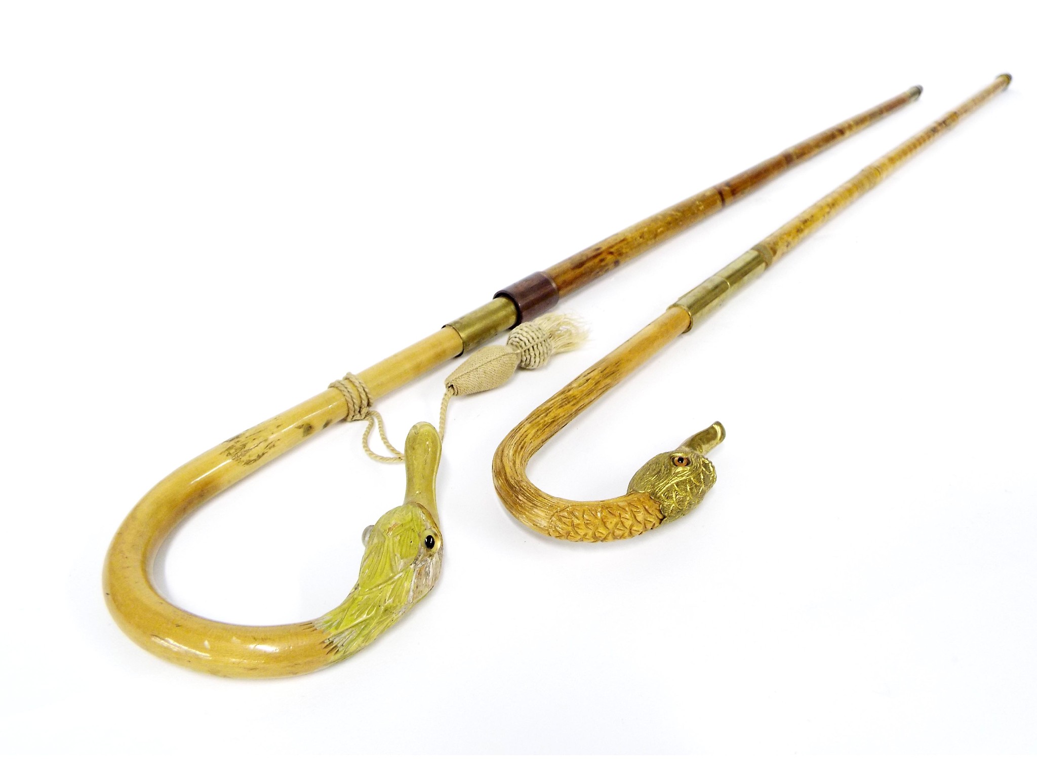 Appraisal: Pair of novelty malacca cane swordsticks each with duck head