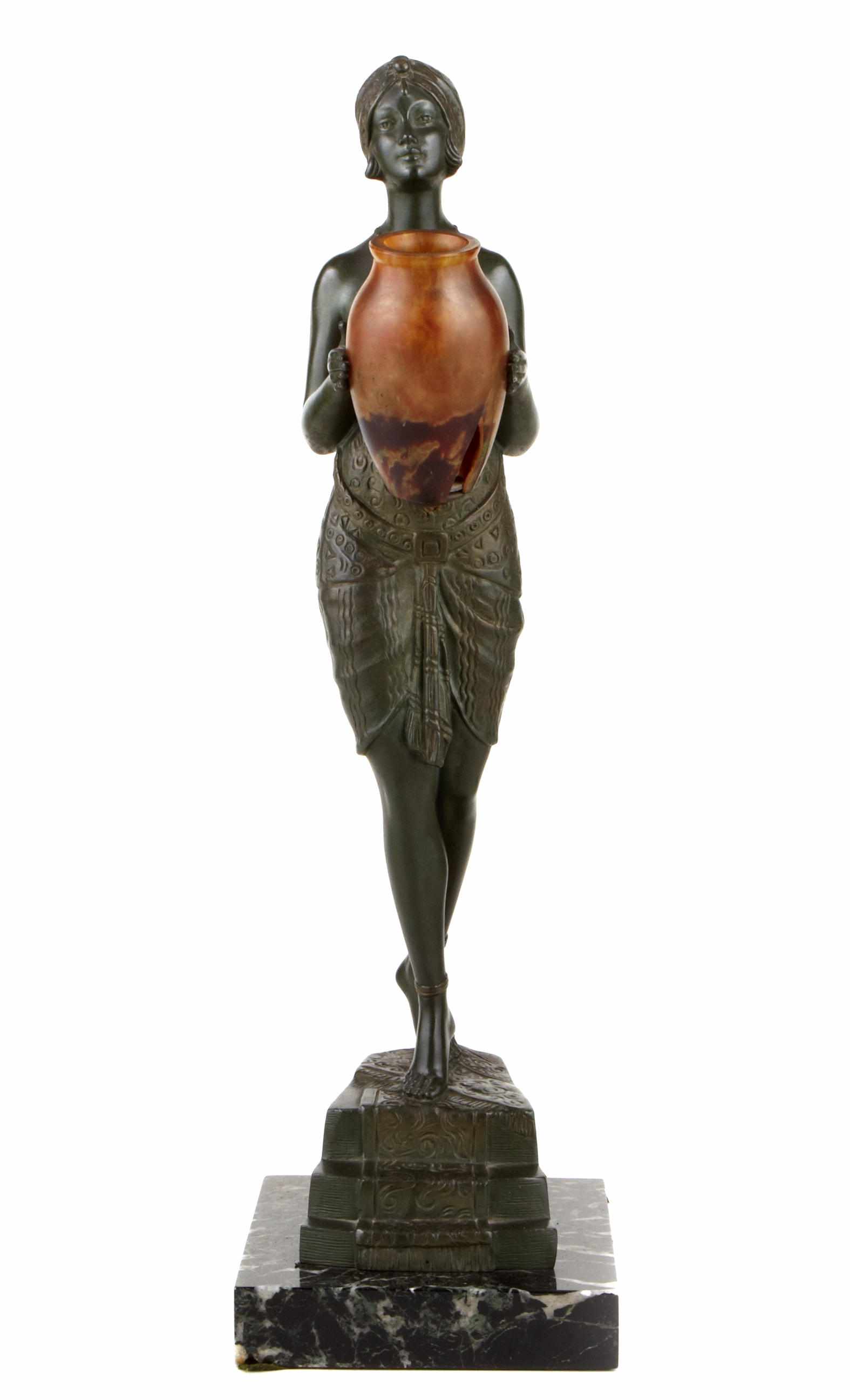 Appraisal: An Art Deco style bronze and glass figural lamp after