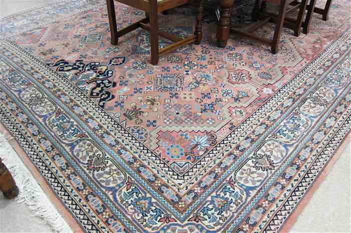 Appraisal: HAND KNOTTED ORIENTAL CARPET Persian design of overall stylized flowers