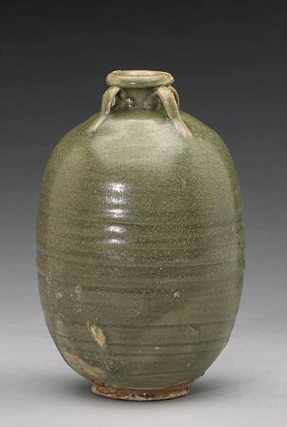 Appraisal: A celadon glazed stoneware storage bottle Thailand th th Century