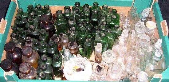 Appraisal: A collection of green glass bottles and sundry other bottles