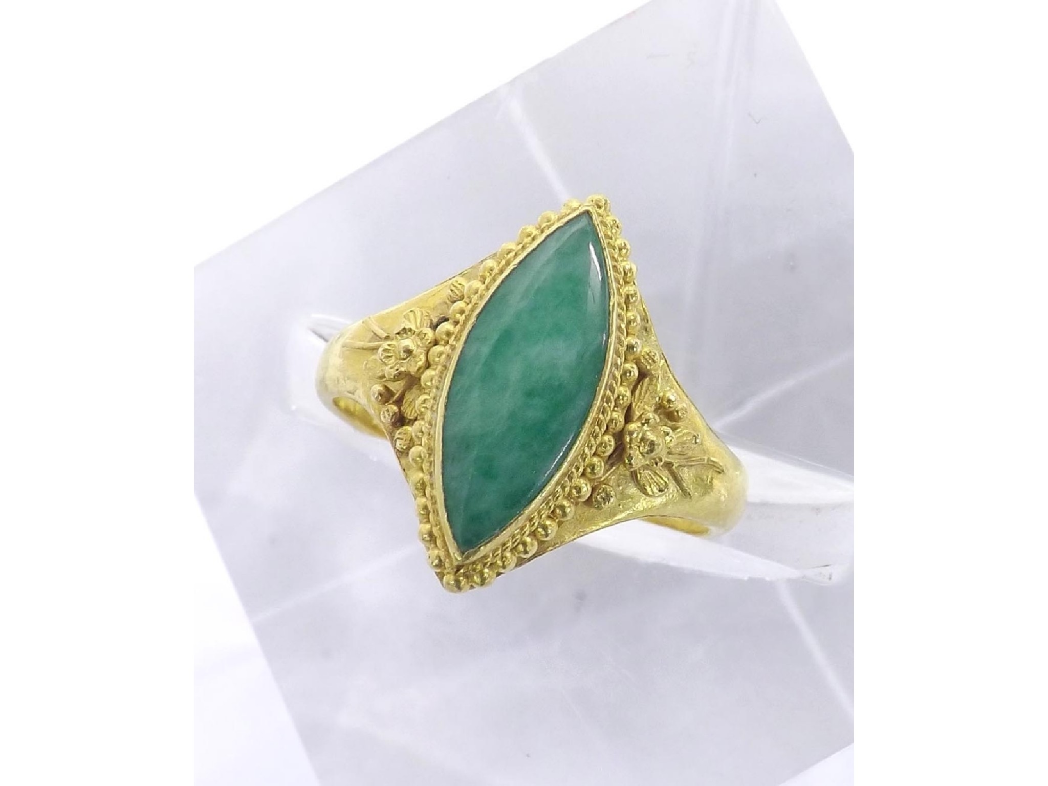 Appraisal: Chinese marquise shaped jade ring the shoulders with floral decoration