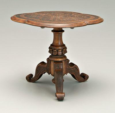 Appraisal: Miniature tilt-top candle stand finely carved with flowers on stippled