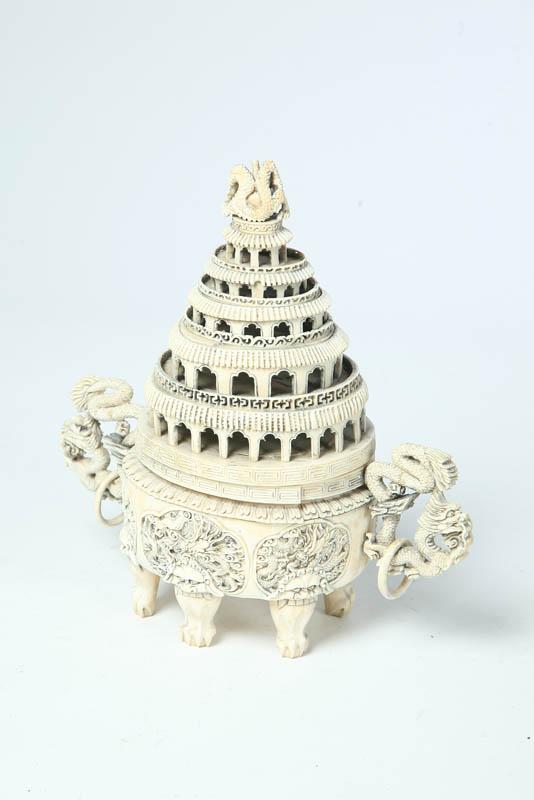 Appraisal: IVORY CARVING China th century Jar with tiered architectural lid