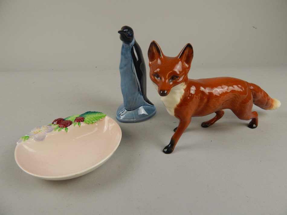 Appraisal: A Beswick model of a fox a Poole pottery penguin