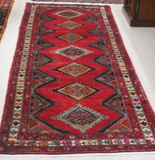 Appraisal: PERSIAN HALL CARPET Hamadan tribal villages region repeating geometric medallion