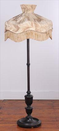 Appraisal: EDWARDIAN-STYLE WALNUT FLOOR LAMP The domed pleated and fringed silk