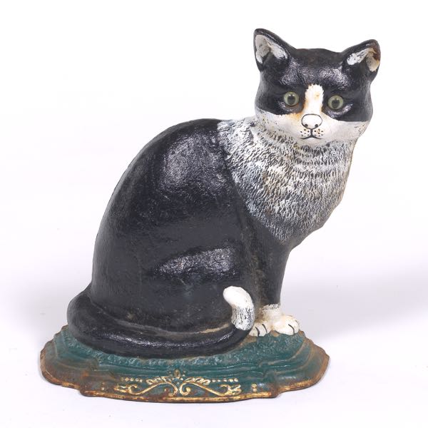 Appraisal: AMERICAN COLD PAINTED CAST IRON CAT WITH GLASS EYES DOOR