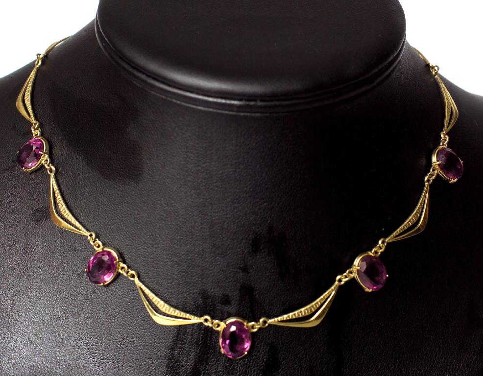 Appraisal: ct GOLD AND AMETHYST NECKLACE designed as swags punctuated by