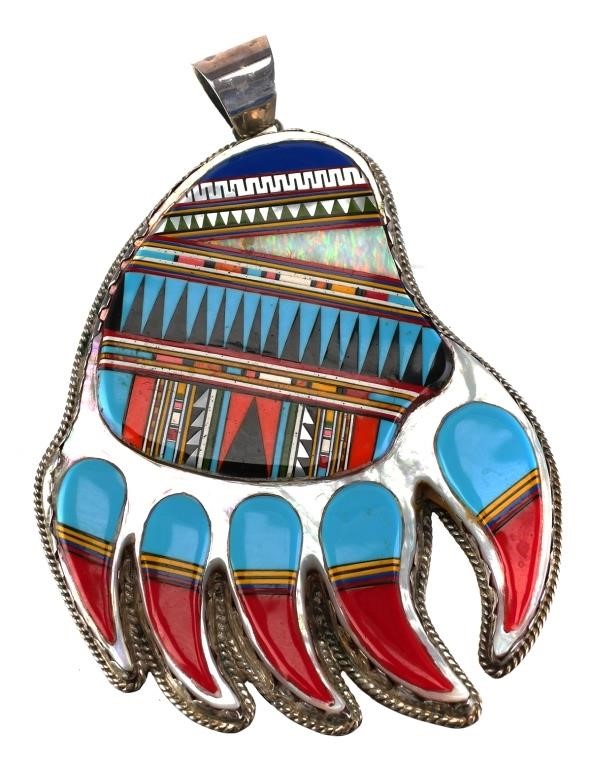 Appraisal: Large sterling silver necklace pendant featuring Native American style multi-colored