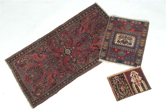 Appraisal: THREE ORIENTAL RUGS Twentieth century Persian Sarouk with an all