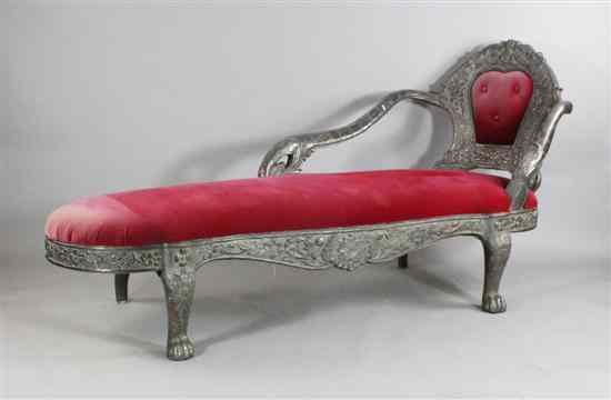 Appraisal: An Indian silver overlaid chaise longue decorated with flowers scrolls