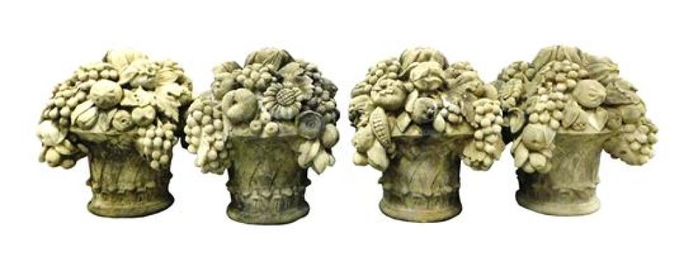 Appraisal: GARDEN Four cement fruit basket sculptures early to mid- th