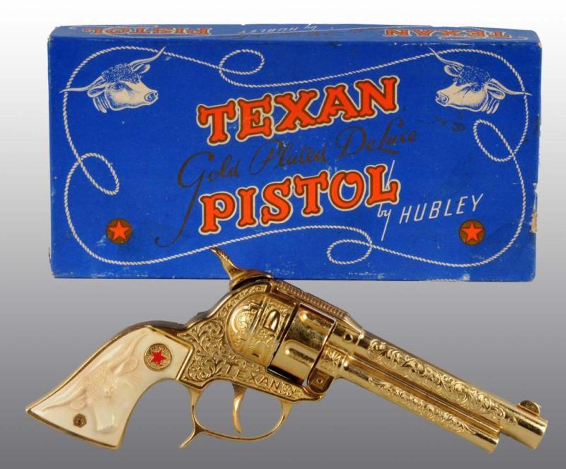 Appraisal: Hubley Texan DeLuxe Gold-Plated Toy Cap Gun Description Includes original