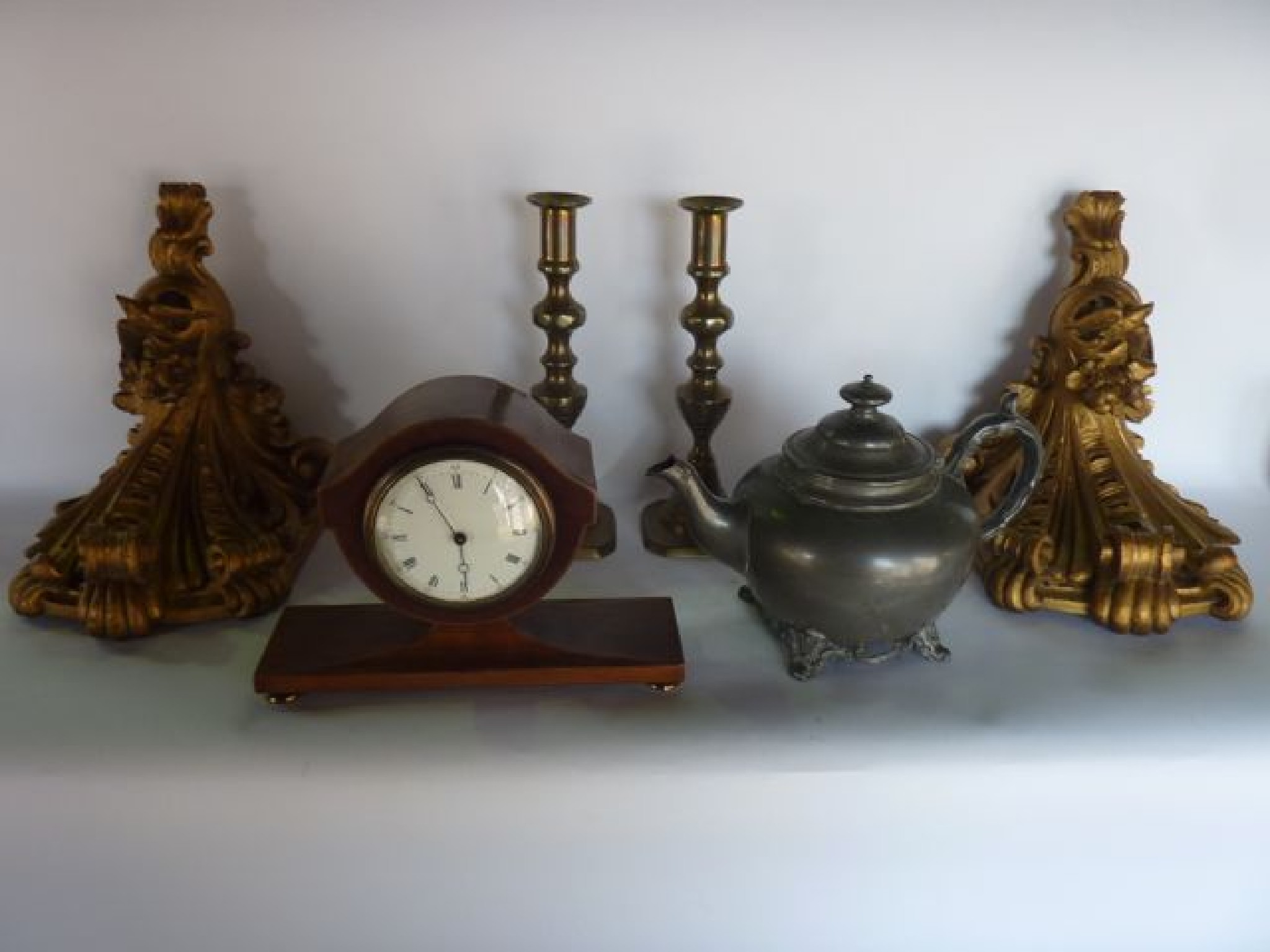 Appraisal: An Edwardian mantle clock with shaped outline with string inlay