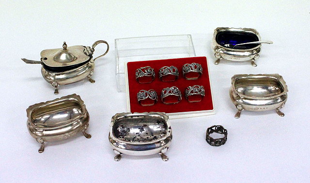 Appraisal: FIVE SILVER CONDIMENT POTS with shaped edges on pad feet