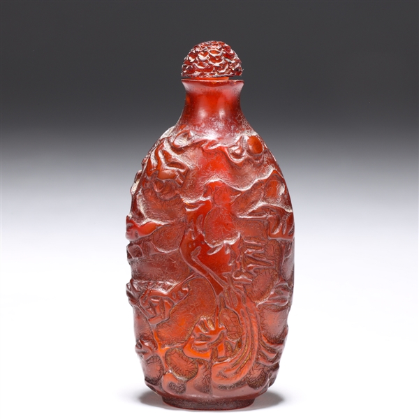 Appraisal: Chinese carved amber snuff bottle with fine details in high