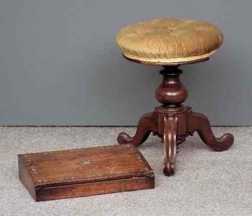 Appraisal: A Victorian rosewood circular adjustable piano stool the seat upholstered