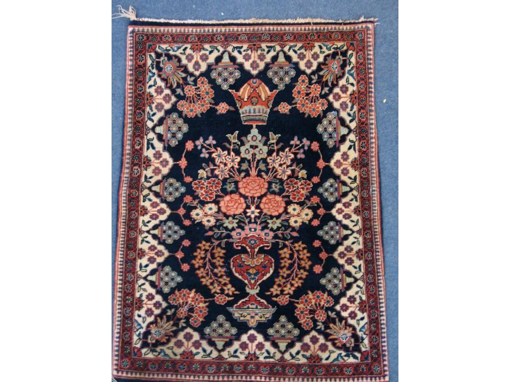 Appraisal: A KASHAN RUG the central dark blue medallion with a