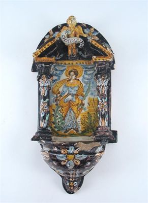 Appraisal: A maiolica wall font probably Caltagirone painted with St Catherine