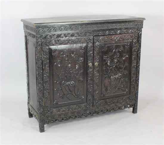 Appraisal: A late th century Chinese carved rosewood cabinet fitted with