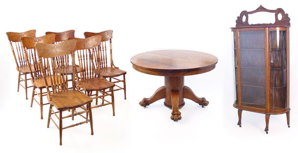 Appraisal: GOLDEN OAK CLAW FOOT ROUND TABLE CHAIRS AND BOW FRONT