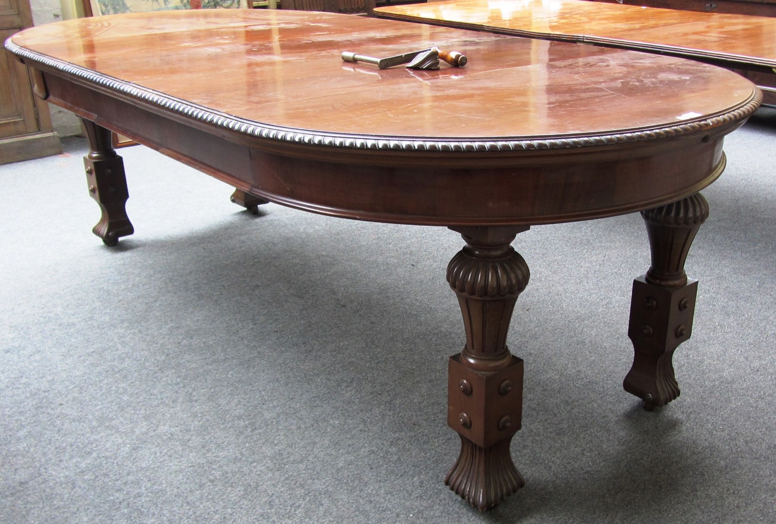 Appraisal: An early th century circular mahogany extending dining table on