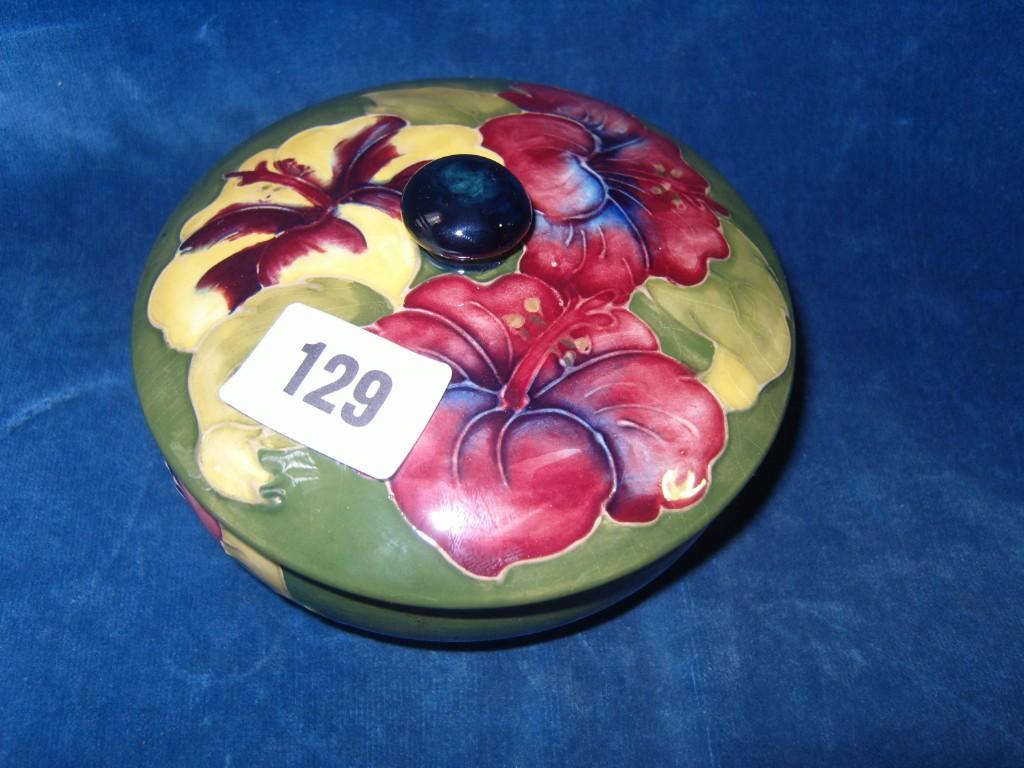 Appraisal: A Moorcroft green ground powder bowl and cover with yellow