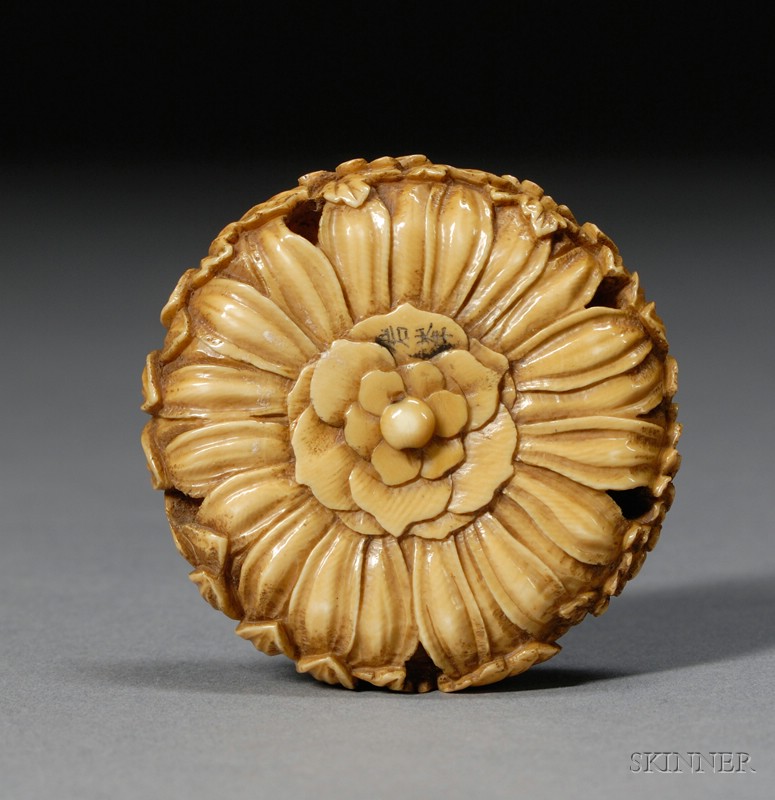 Appraisal: Ivory Netsuke th century surface carved with chrysanthemums dia in