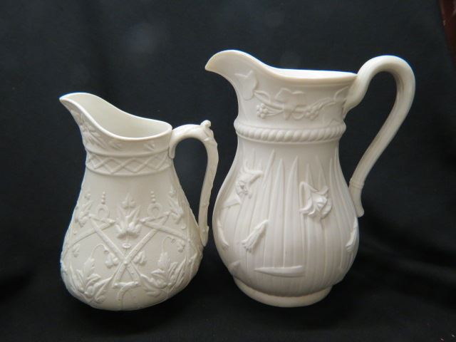 Appraisal: Early English Relief Pitchers florals and circa excellent