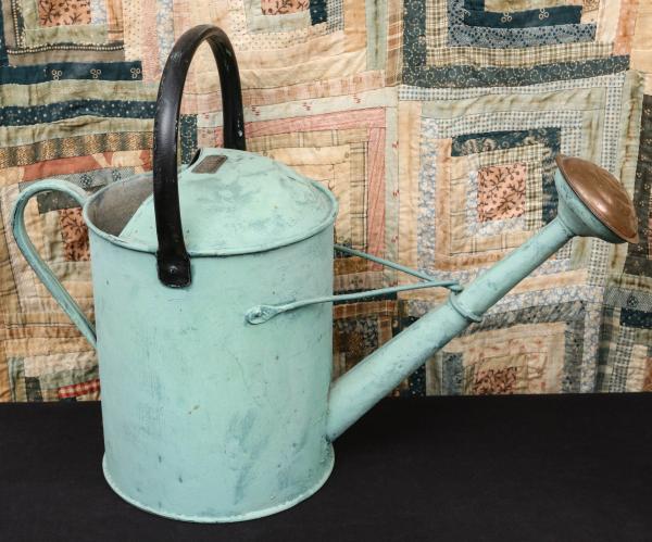 Appraisal: AN ANTIQUE TWO GALLON WATERING CANThe classic example is painted