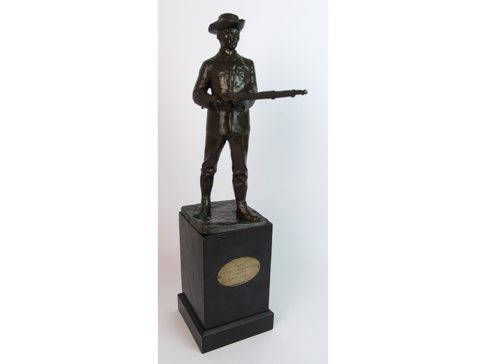 Appraisal: A Swedish WWI Memorial bronzed sculpture the uniformed soldier modelled