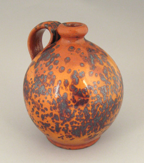 Appraisal: Redware jug th c with profuse manganese splash decoration h