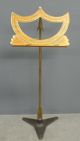 Appraisal: - Brass music stand in the form of an arrow