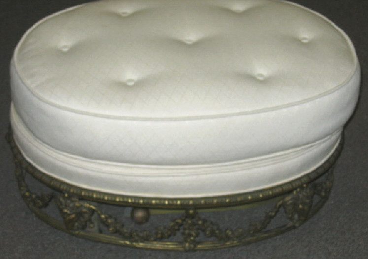 Appraisal: CONTINNETAL GILT METAL UPHOLSTERED OTTOMAN White padded top on the