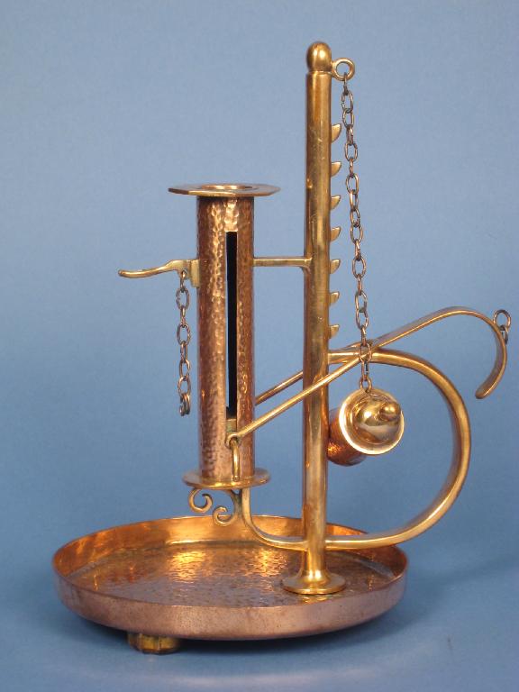 Appraisal: An Arts Crafts copper adjustable Chamberstick with hammered design in