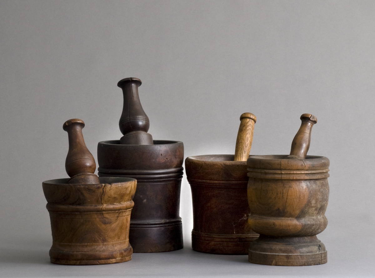 Appraisal: FOUR LIGNUM VITAE MORTARS AND PESTLES Overall height of largest