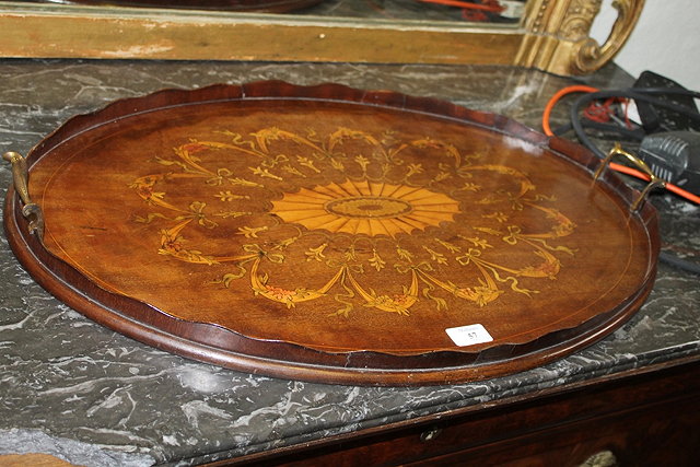 Appraisal: A VICTORIAN MAHOGANY AND SATINWOOD INLAID TRAY with central shell