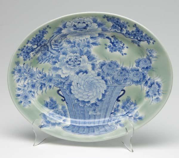 Appraisal: JAPANESE PORCELAIN Oval plate with underglaze blue vase with flowers