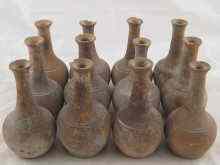 Appraisal: Twelve Middle Eastern ceramic unglazed vessels with tall narrow necks