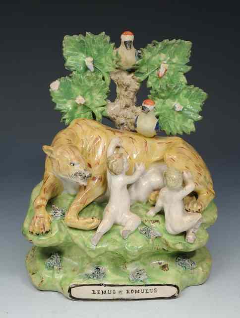 Appraisal: A STAFFORDSHIRE POTTERY GROUP OF ROMULUS AND REMUS early th