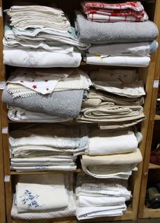 Appraisal: Four shelves of assorted bed and table linens Four shelves