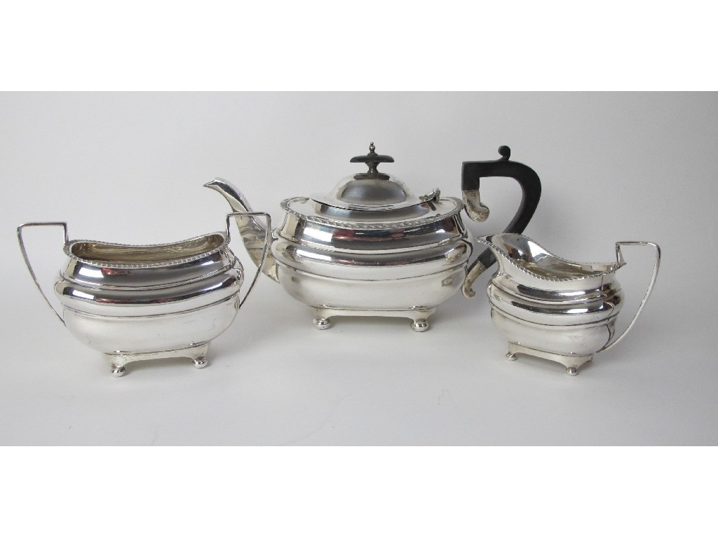 Appraisal: A three piece silver tea service of rounded rectangular form