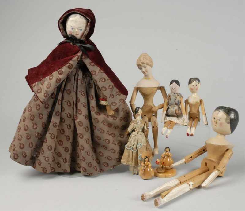 Appraisal: Lot of Wood Dolls Description Antique peg-wood doll with lovely