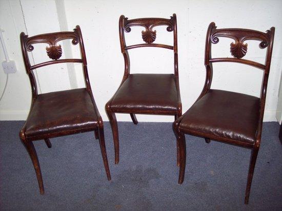 Appraisal: A set of four Regency style dining chairs fitted trap